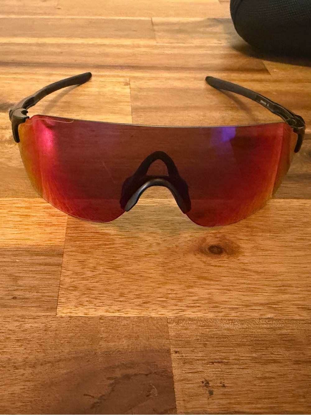 Oakley Black Frame Sunglasses with Red Mirrored Shield Lens